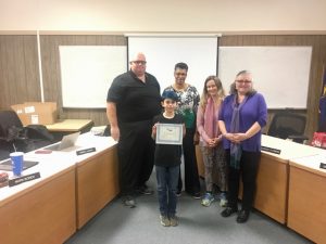 Award winner with school board members