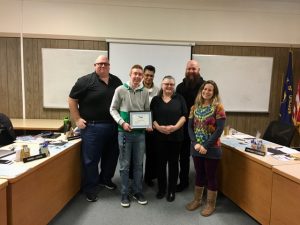 award winner with school board members