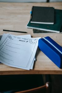 elementary school worksheet and supplies on a desk