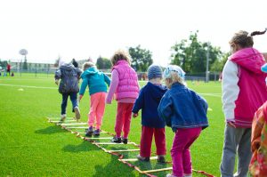 kids playing outside on a field